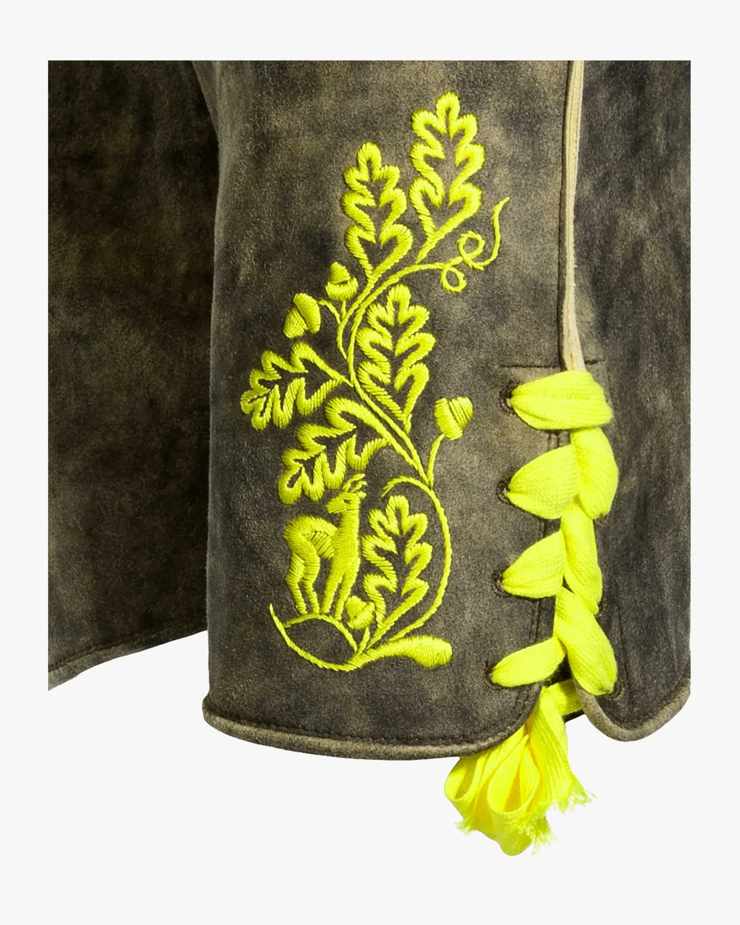 Embroidered design on a dark fabric with yellow thread