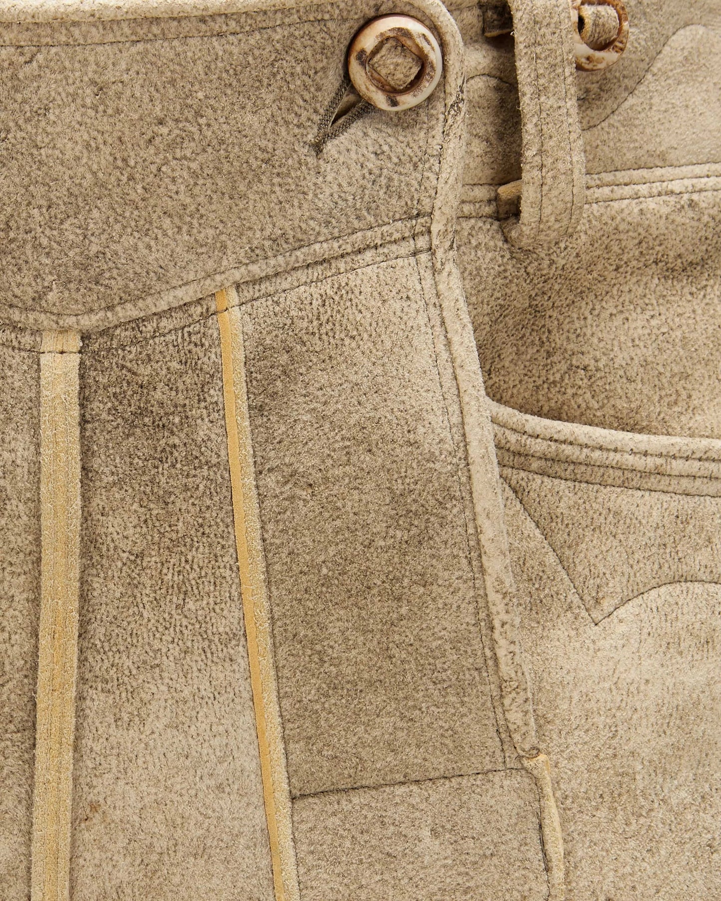 Close-up of beige fabric with stitching details