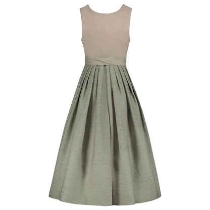 Two-tone dress with beige top and green skirt on a white background