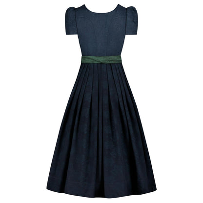 Navy blue dress with a green belt on a white background