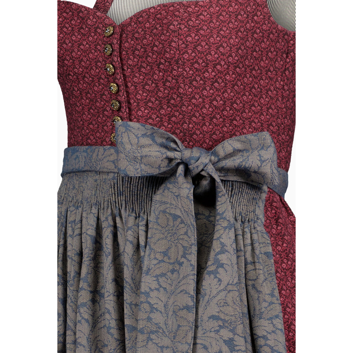 Two-patterned dress with a red floral top and blue paisley skirt on a white background