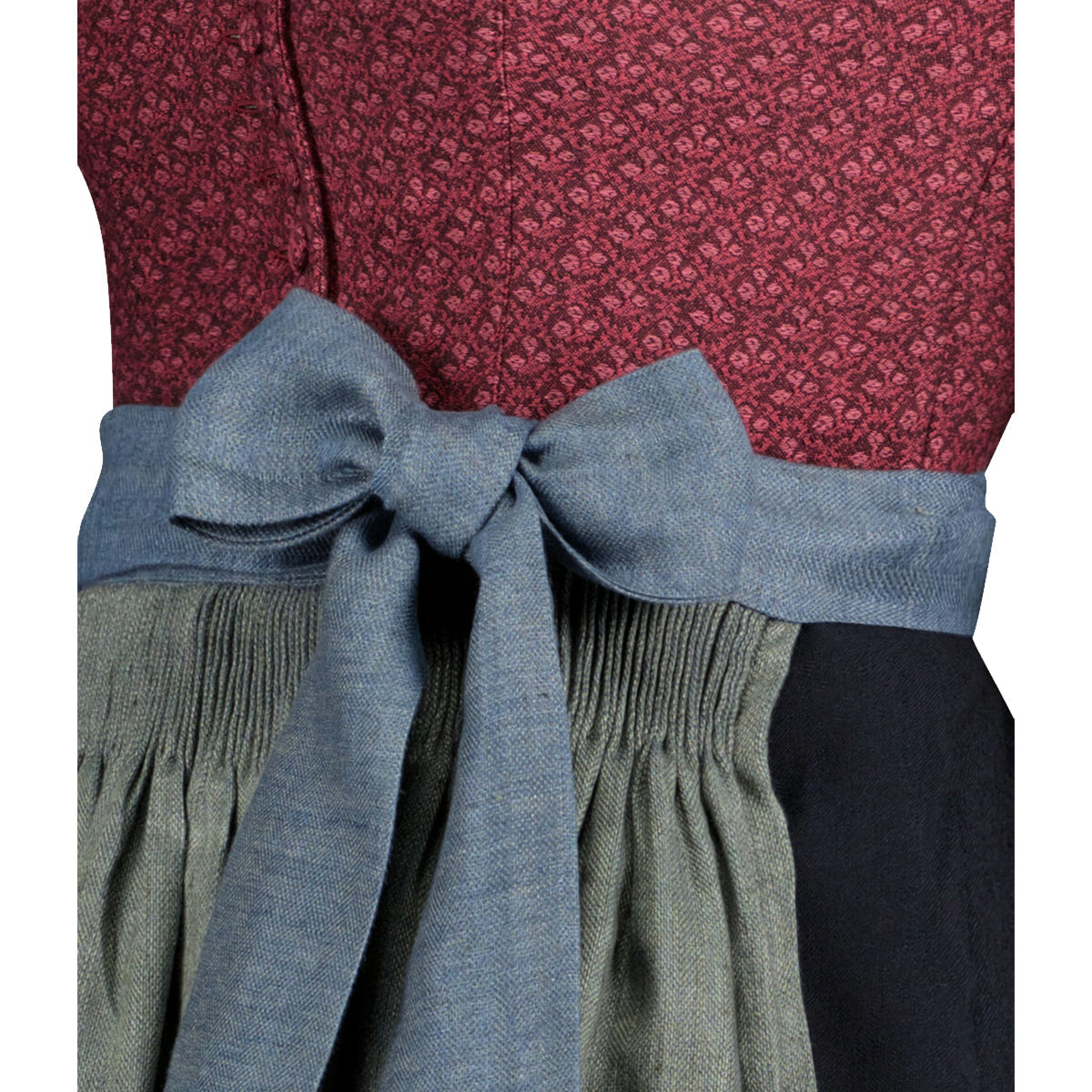Close-up of a red patterned top with a blue bow and green pleated skirt on a white background