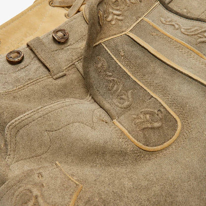 Close-up of beige leather goods with branding details