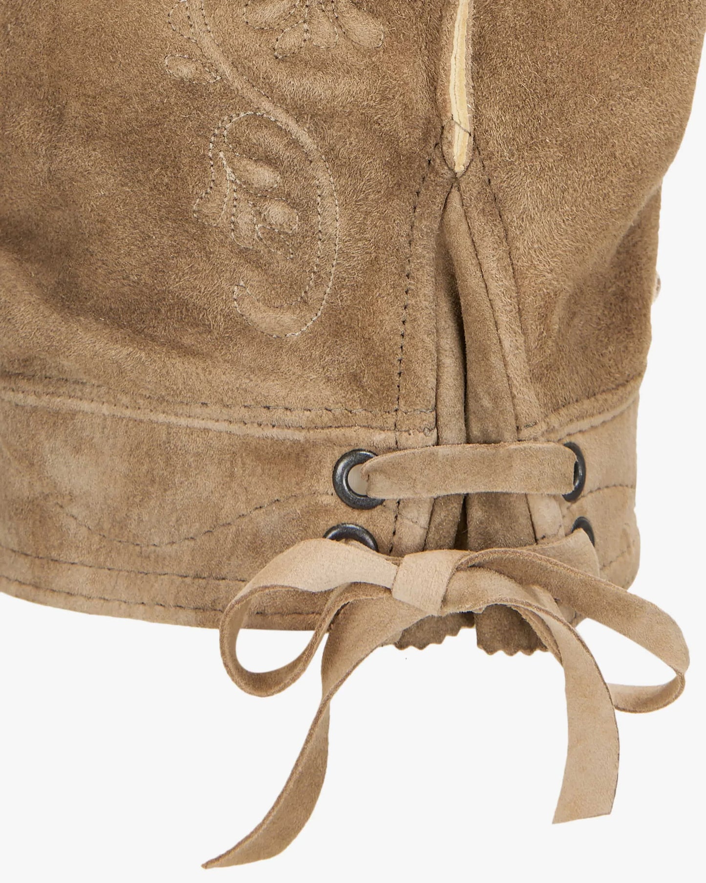 Close-up of a beige leather boot with lace-up design on a white background
