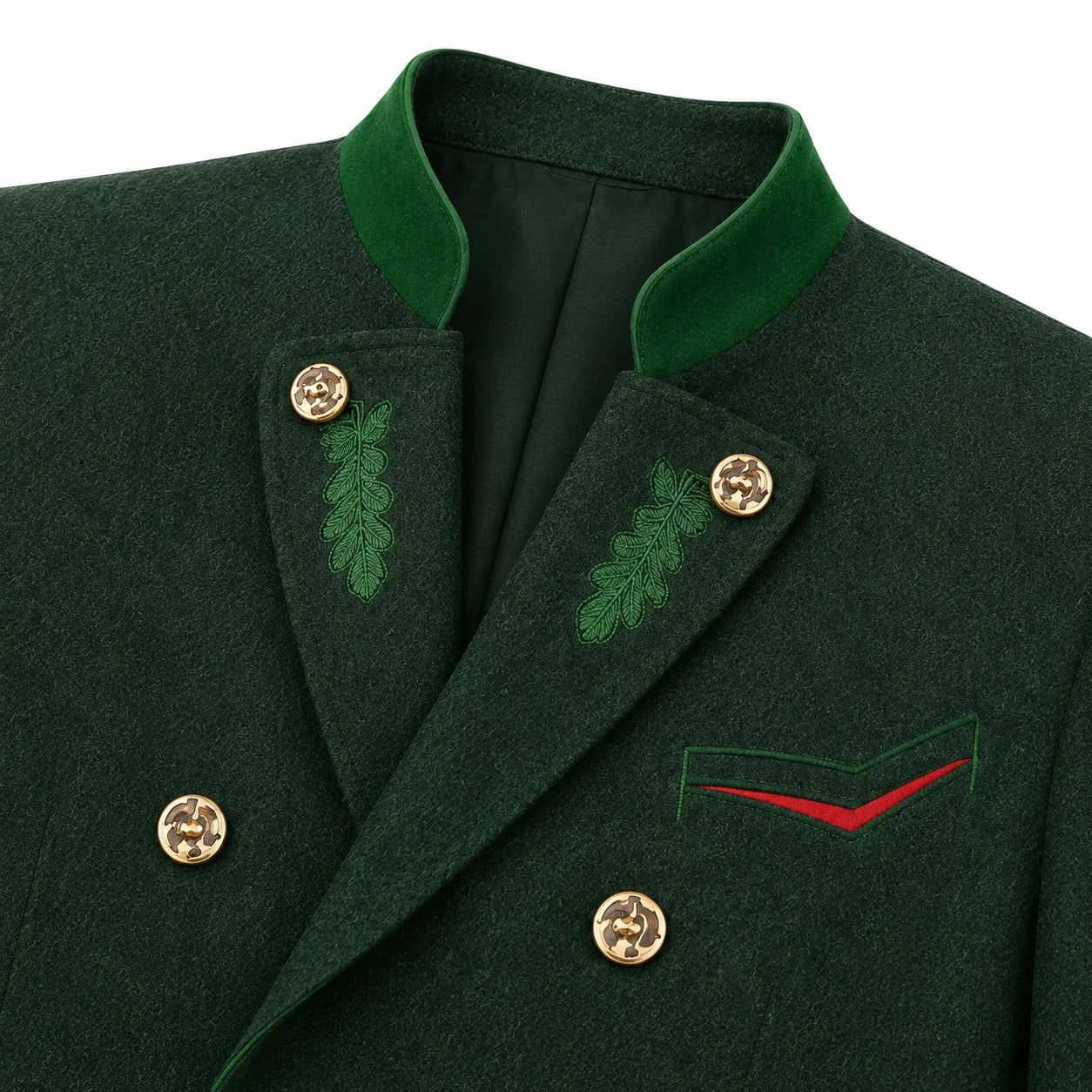 Close-up of a dark green double-breasted jacket with green velvet-like collar, gold buttons, embroidered green leaf motifs, and a red chevron detail on the chest.