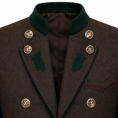 Close-up of a dark brown textured wool coat with a dark green velvet collar, green embroidered leaf details on the lapels, and ornate gold buttons.