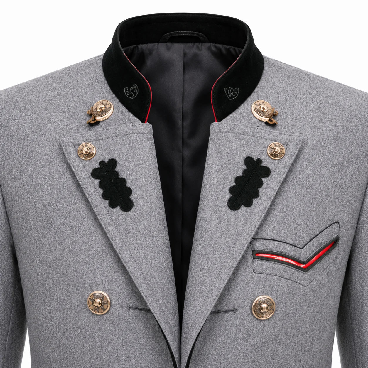 Close-up of a gray military-style double-breasted blazer with black peak lapels, gold buttons, black embroidered insignia, and red piping details on the pocket and collar.