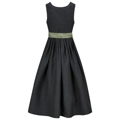 Black patterned dress with a green belt on a white background