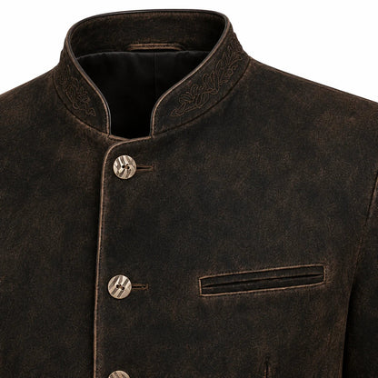 Close-up of a dark brown textured jacket with a mandarin collar, decorative embroidery on the collar, and three metallic buttons.