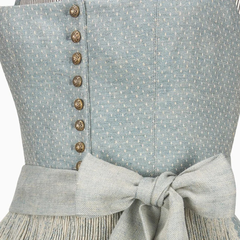 Close-up of a light blue dress with buttons and a bow detail.