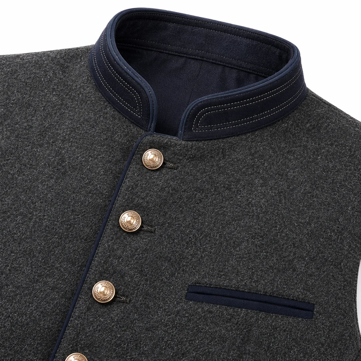 Close-up of a dark gray textured wool vest with a dark navy stand collar, double-breasted buttons, and a matching navy chest pocket.