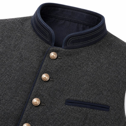 Close-up of a dark gray textured wool vest with a dark navy stand collar, double-breasted buttons, and a matching navy chest pocket.