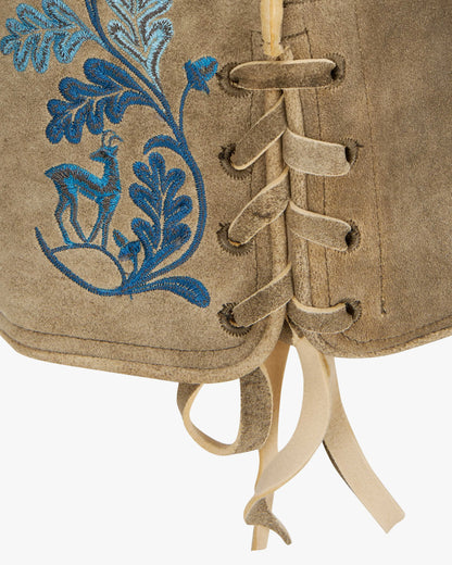 Beige leather boot with blue floral embroidery and laces on a white background