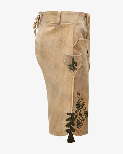 Beige pants with decorative elements on a white background