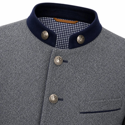 Close-up of a gray textured jacket with a dark navy stand collar, decorative metal buttons, and a gingham lining visible inside the collar.