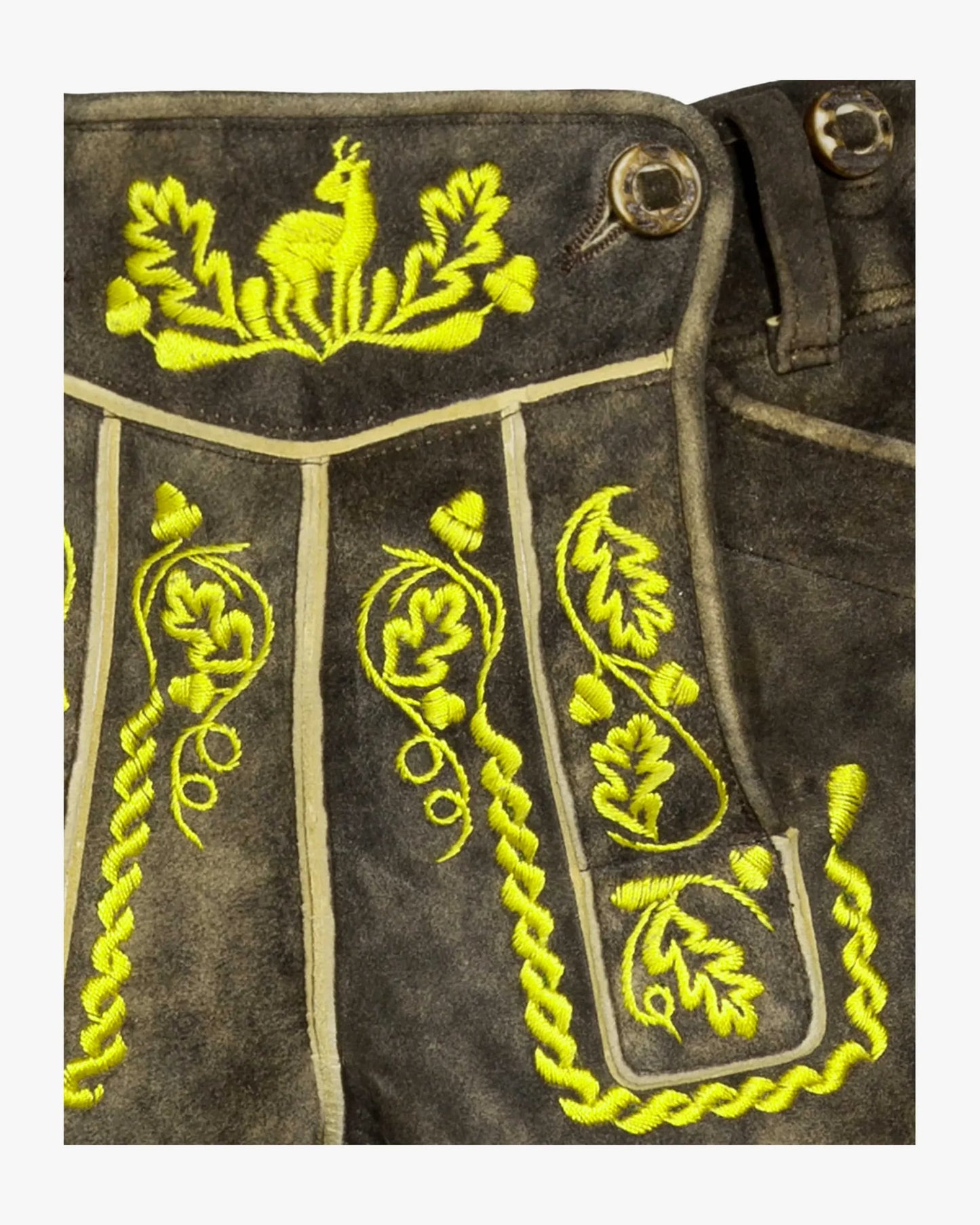 Embroidered design on a dark fabric background with yellow thread