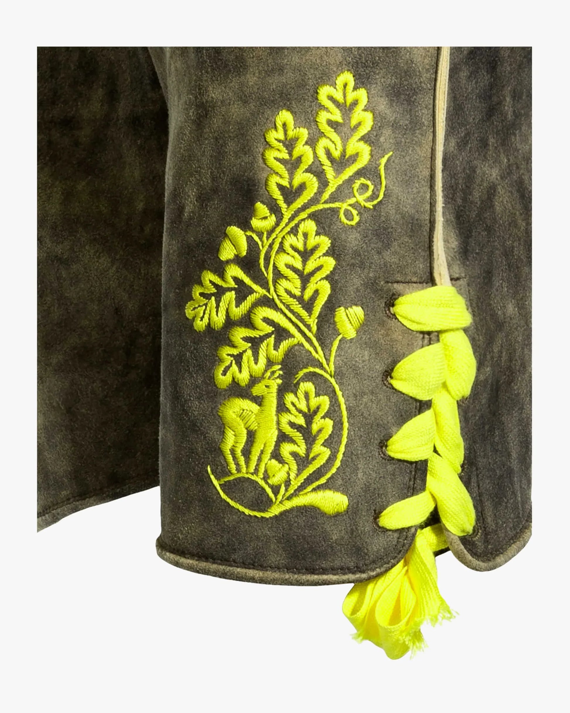 Embroidered design on a dark fabric with yellow thread