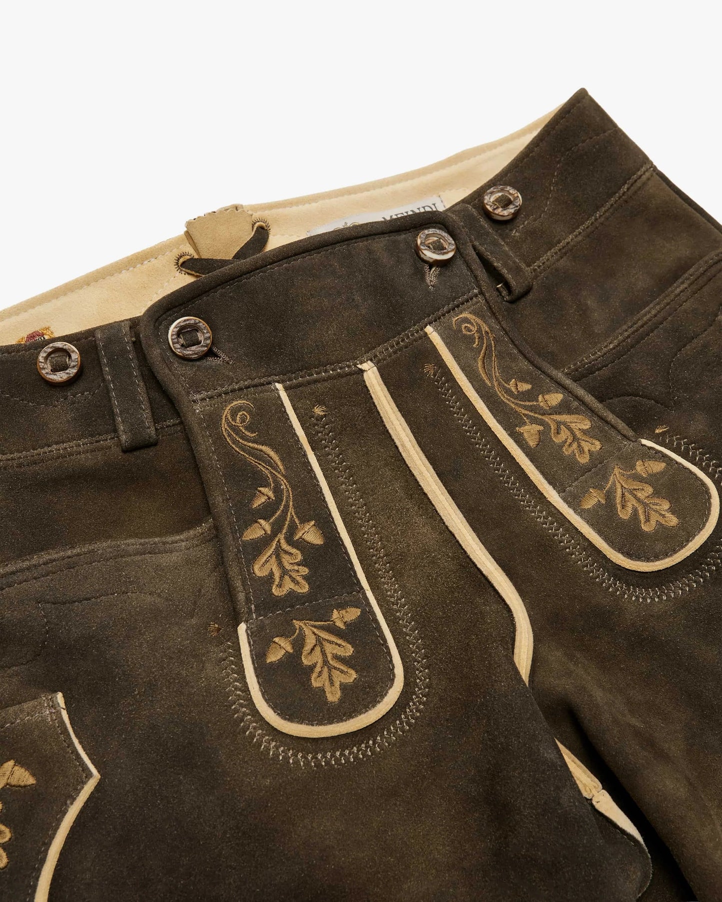 Brown leather pants with gold embroidery on a white background