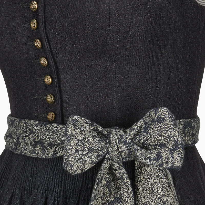 Black dress with gold buttons and a patterned belt on a plain background