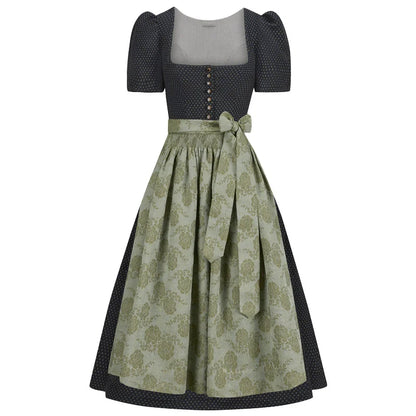 Two-piece dress with a patterned dirndl skirt and polka dot top on a white background
