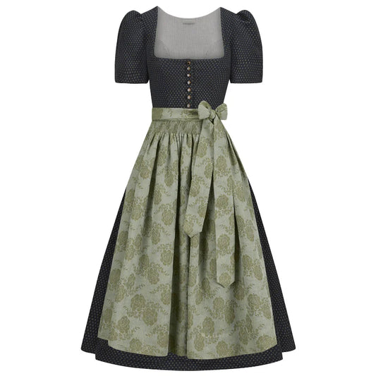 Two-piece dress with a patterned dirndl skirt and polka dot top on a white background