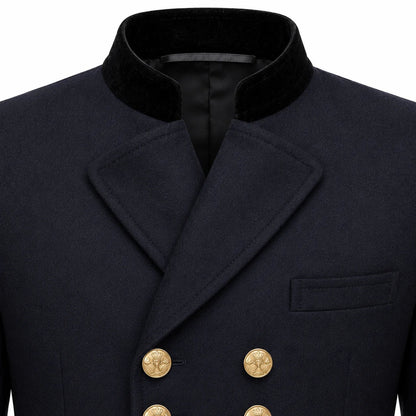 Close-up of a dark navy double-breasted coat with a black velvet collar and gold buttons, shown on a white background.