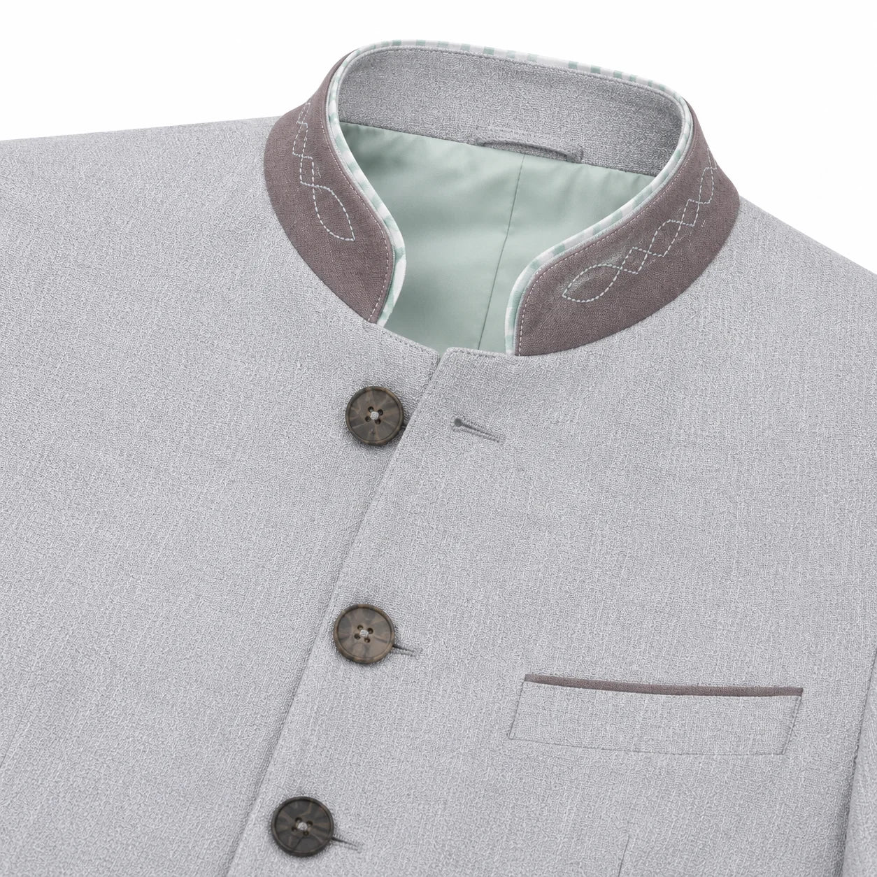 Close-up of a light gray textured jacket with a mandarin collar, featuring a contrasting brownish-gray inner collar with white embroidery, a pale green lining, and three dark buttons.