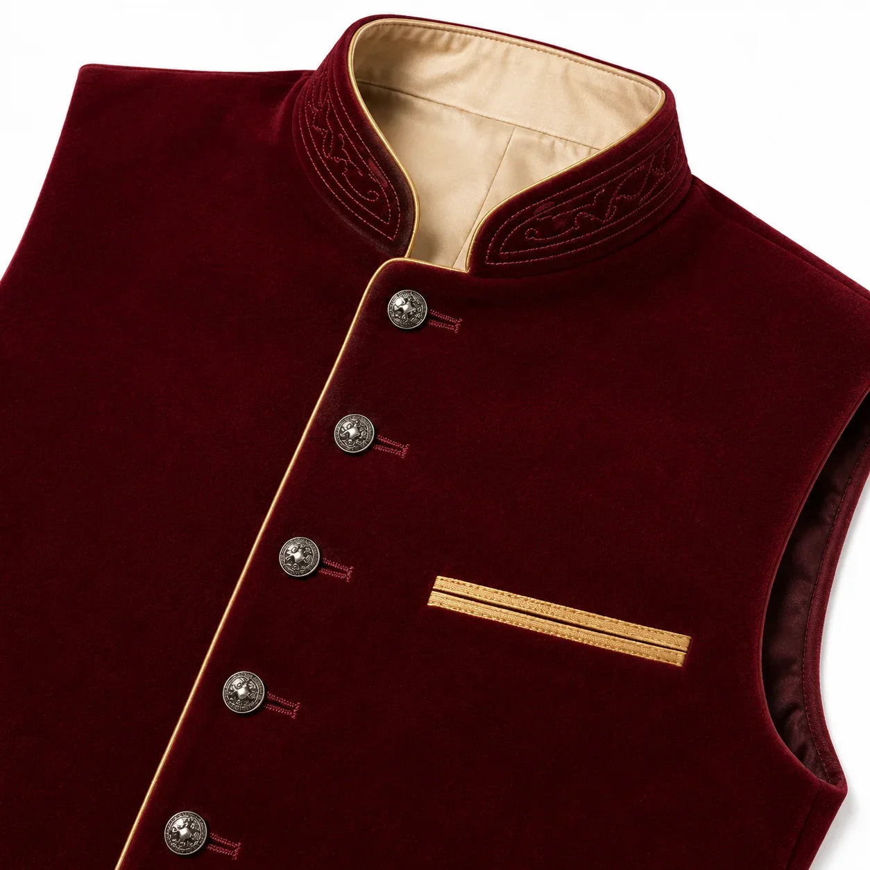 A close-up of a sleeveless maroon velvet vest with a mandarin collar, decorative embroidery on the collar, silver buttons, and gold trim details.