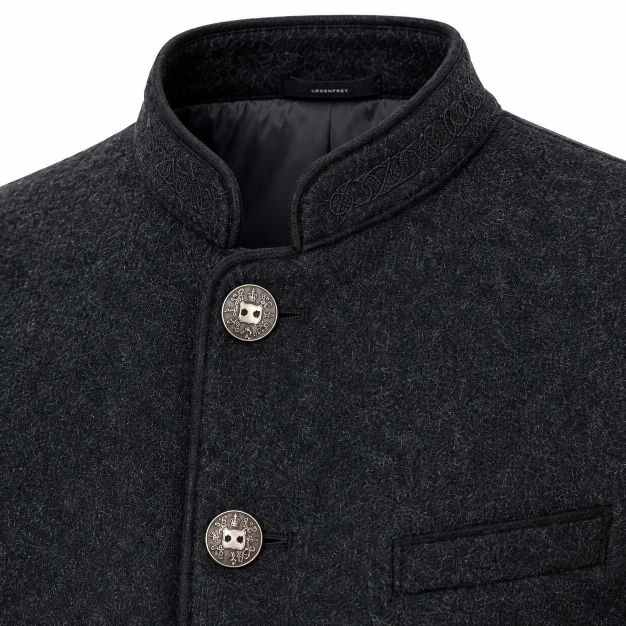 Close-up of a dark charcoal gray textured wool jacket with a mandarin collar, decorative embroidered details on the collar, and two round silver-tone buttons with a central owl emblem.