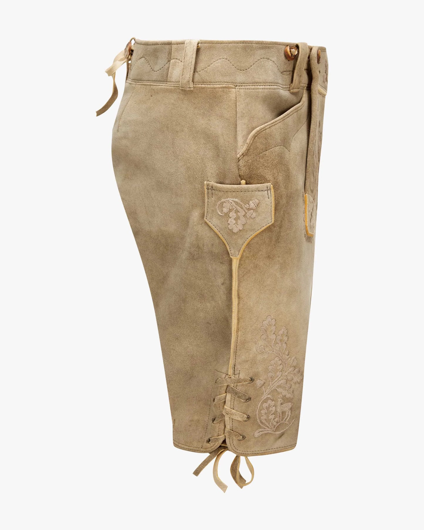 Pair of beige leather pants with lace-up front on a white background