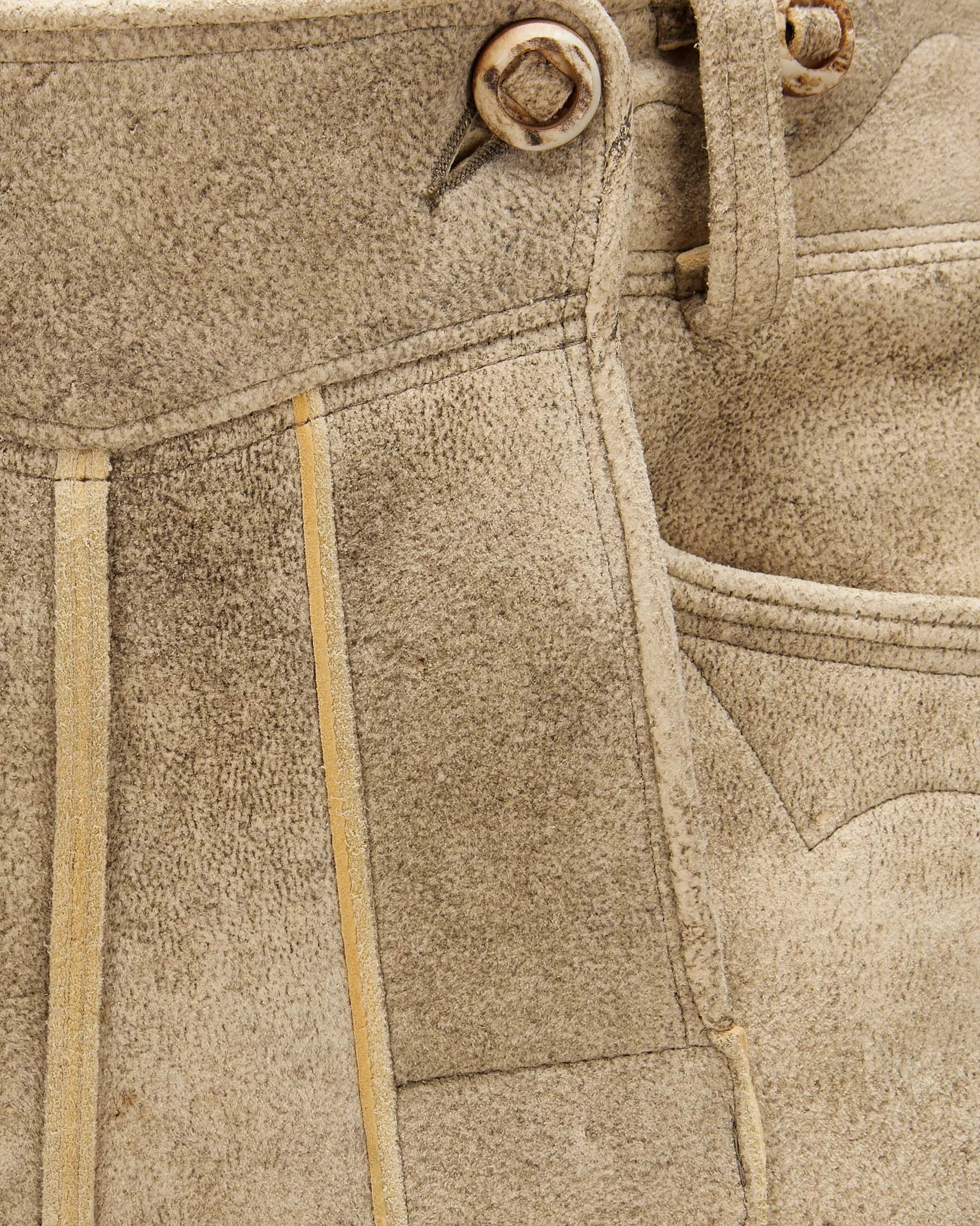Close-up of beige fabric with stitching details