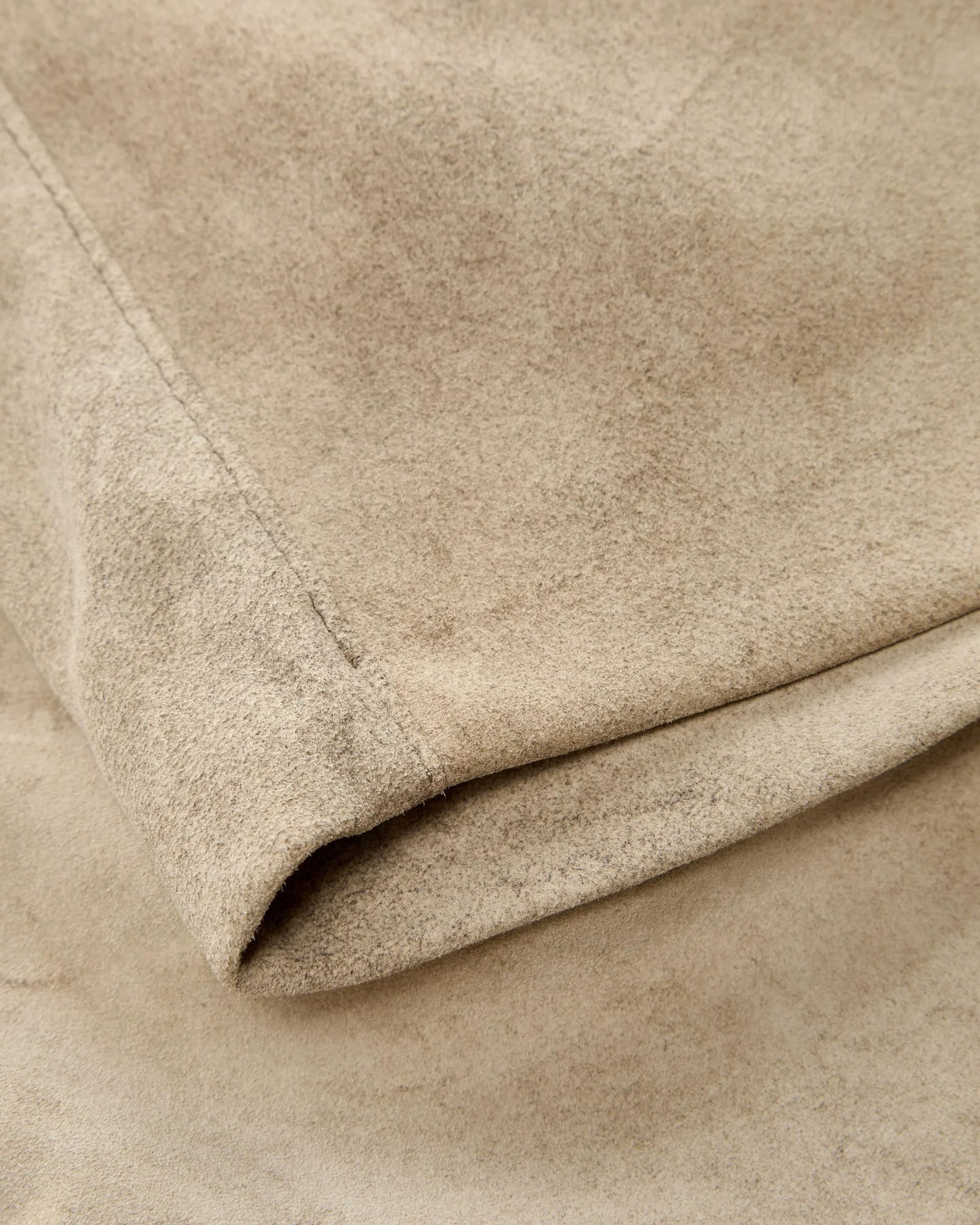 Close-up of beige fabric with a soft texture