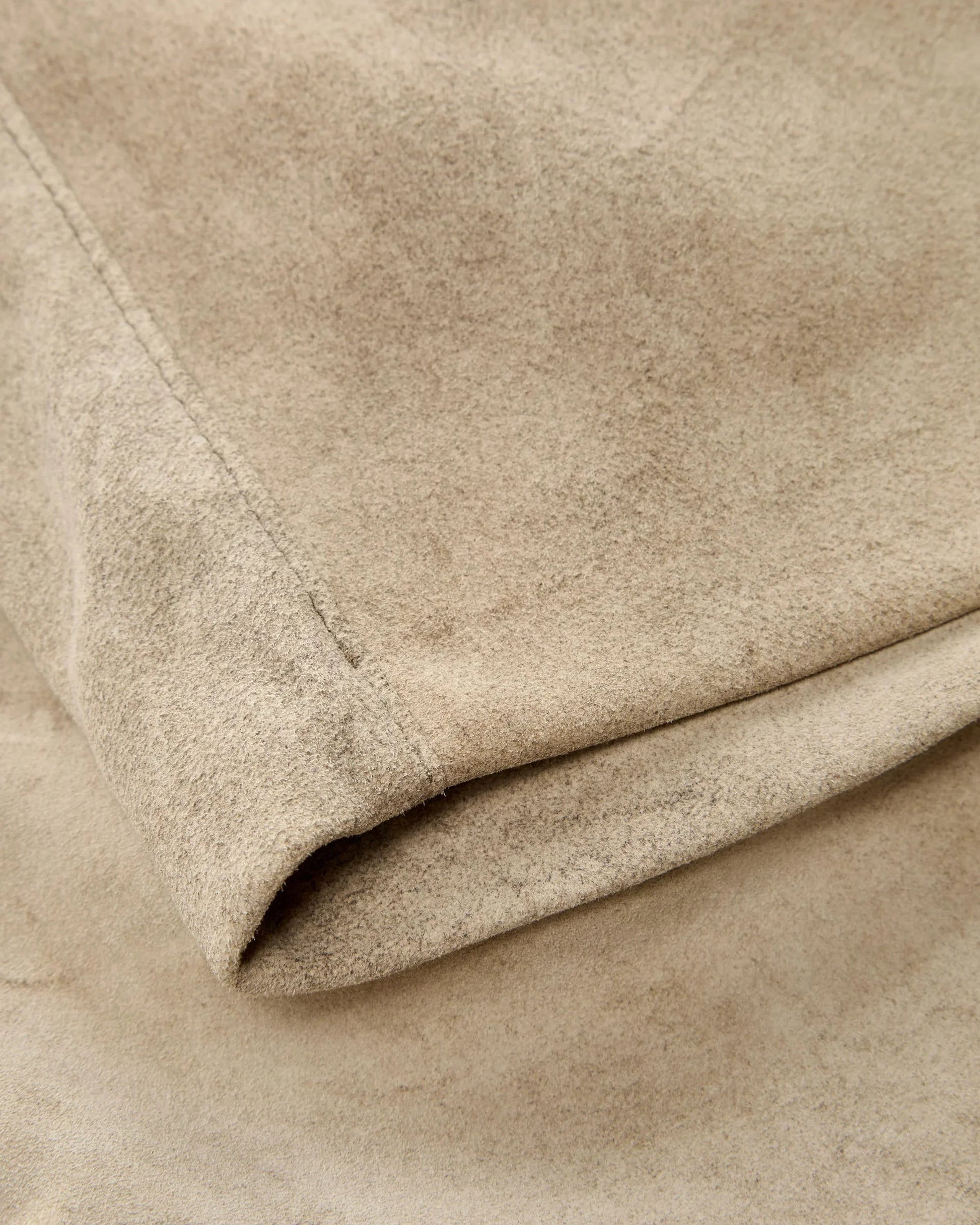 Close-up of beige fabric with a soft texture