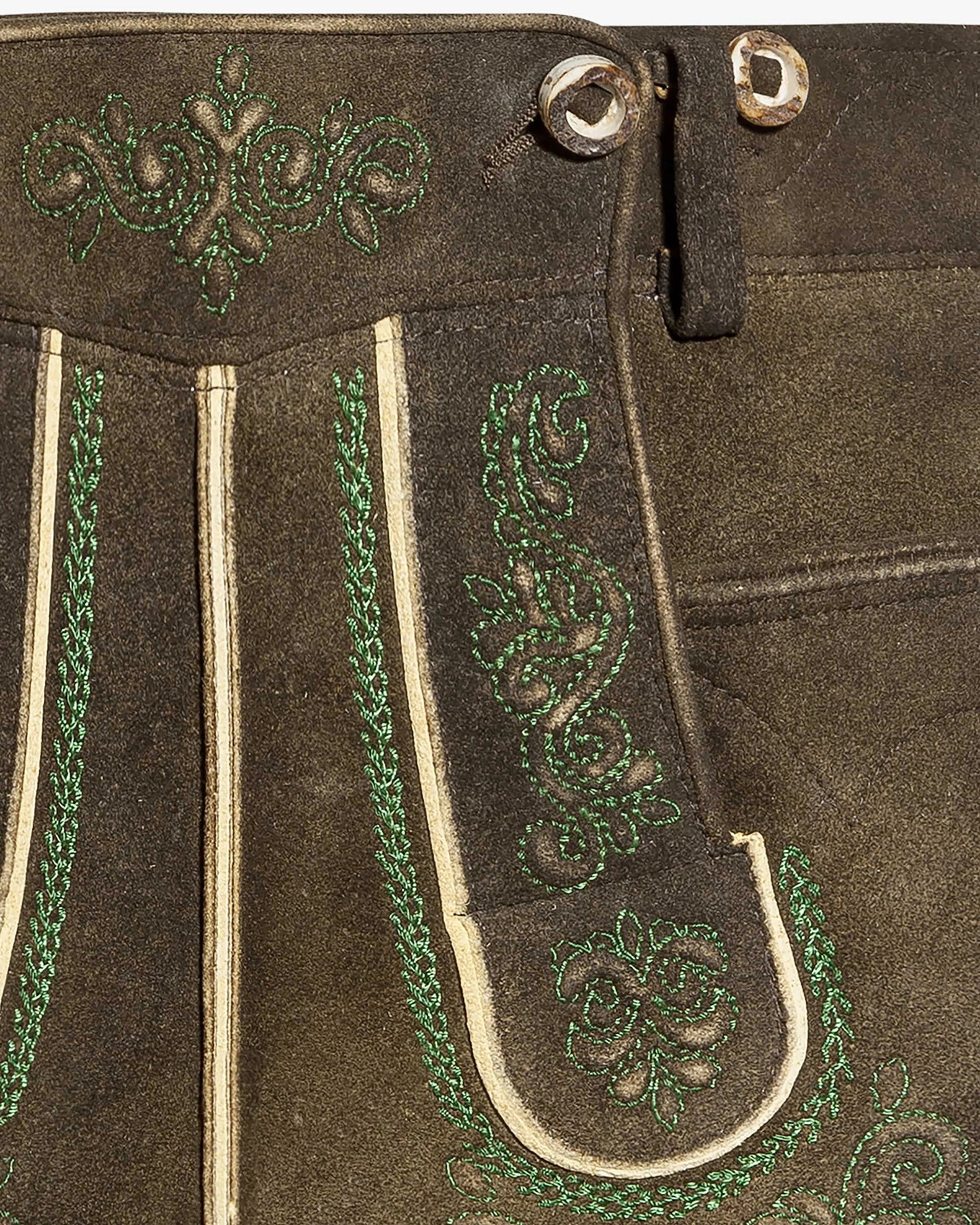 Brown leather pants with green embroidery and white stitching