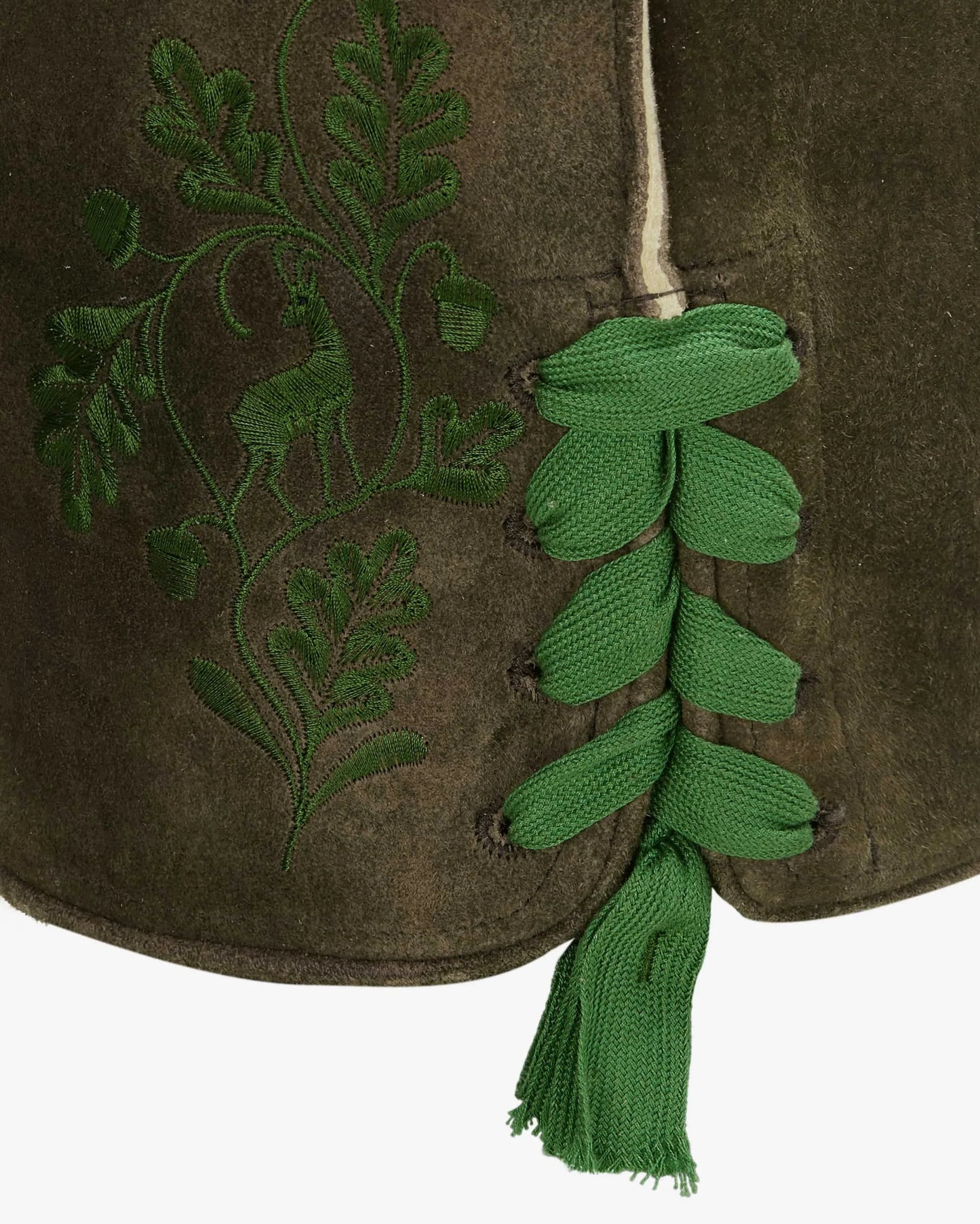 Green embroidered design on a brown fabric with a tassel