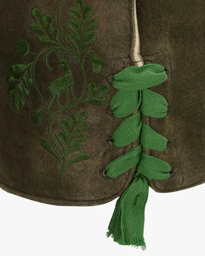 Green embroidered design on a brown fabric with a tassel