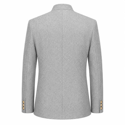 A light gray textured blazer shown from the back, featuring a clean collar, structured shoulders, and gold button accents on the cuffs, set against a plain white background.