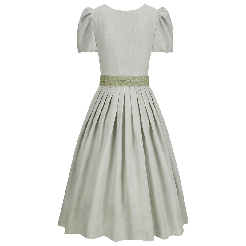 Light gray dress with a green belt on a white background