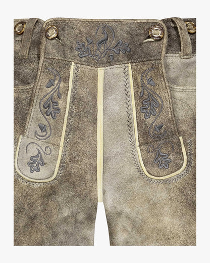 Traditional German lederhosen with intricate embroidery on a white background