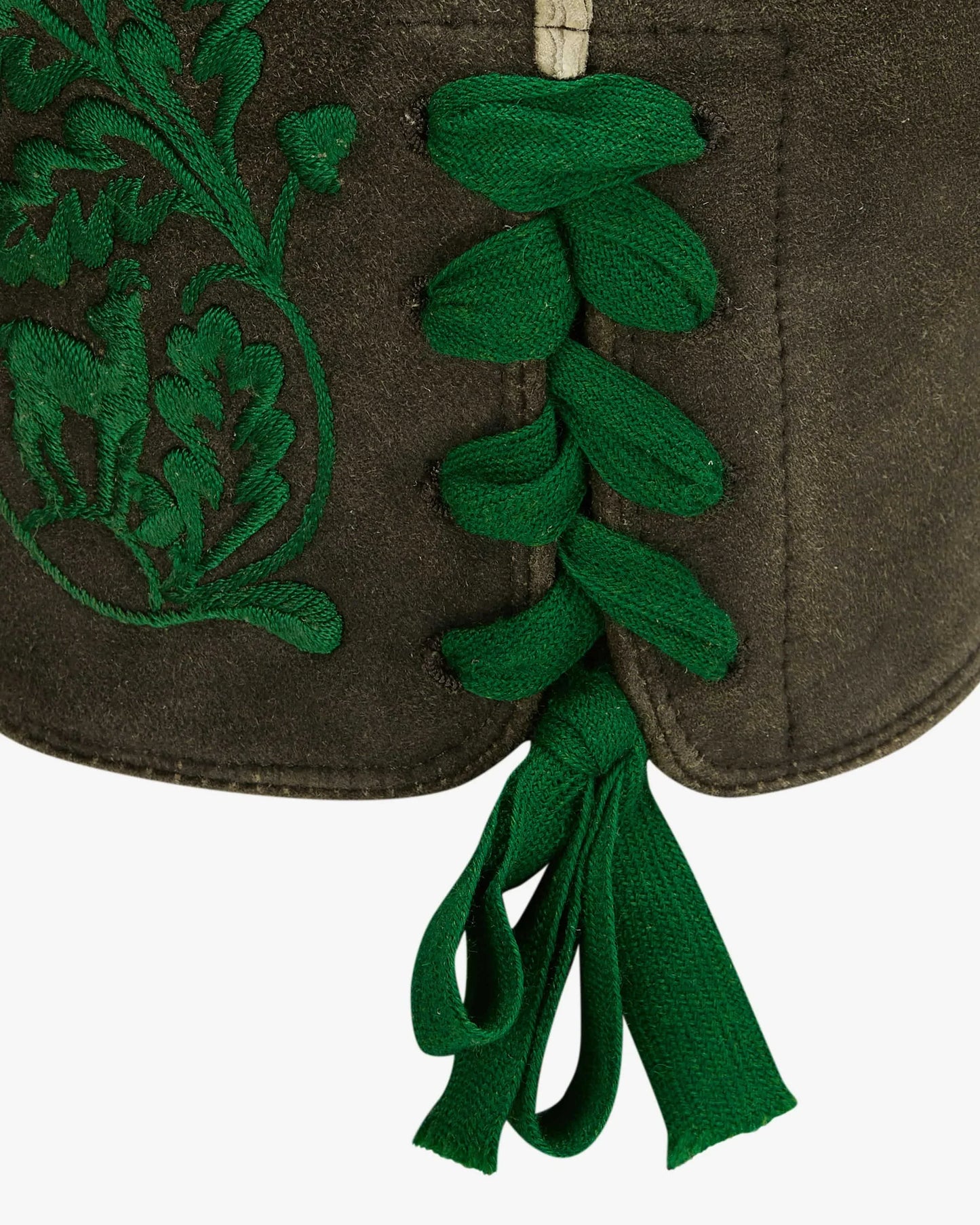 Brown fabric pouch with green embroidered leaves and ribbons on a white background