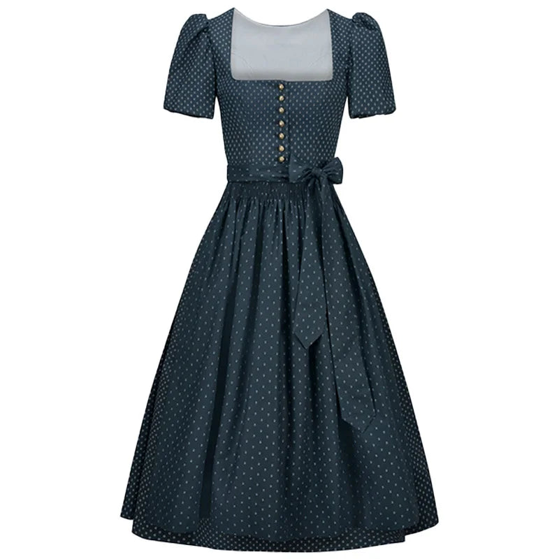 Navy polka dot dress with a white top on a white background