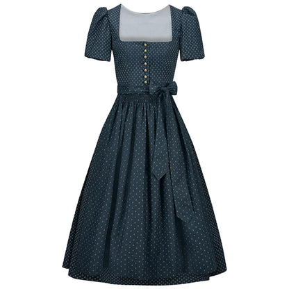 Navy polka dot dress with a white top on a white background