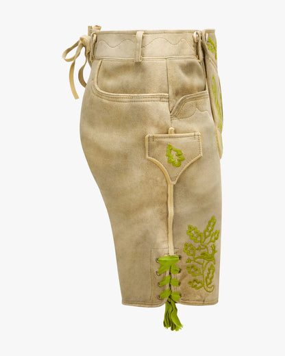 Beige shorts with green embroidery on a white background
