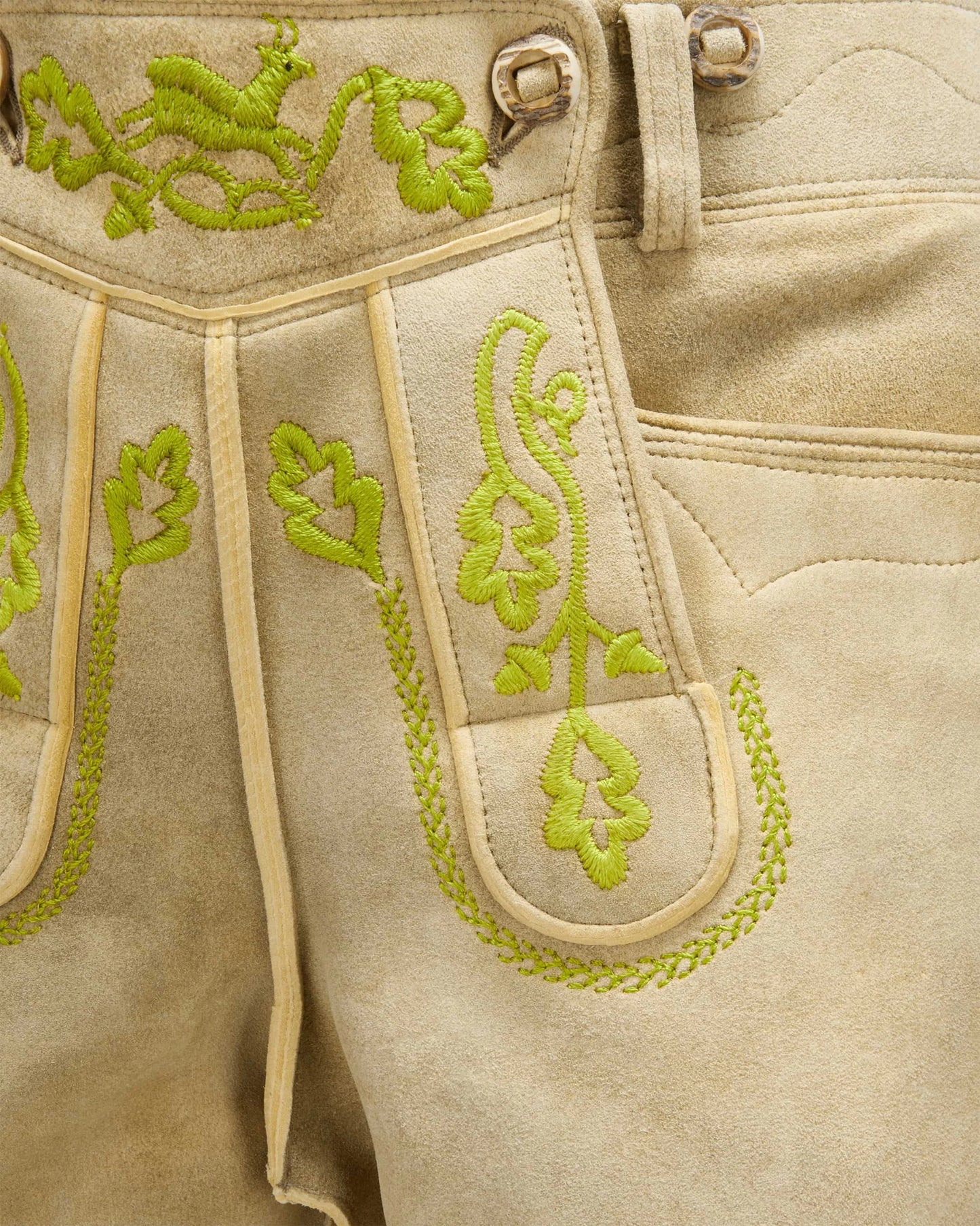 Beige fabric with green embroidery details