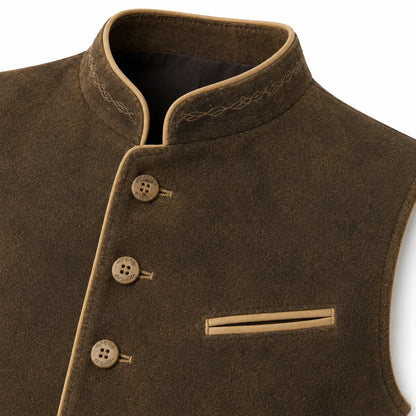 Close-up of a brown wool vest with a mandarin collar, decorative stitching, three button closures, and a welt pocket on a white background.