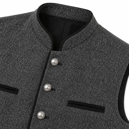 Close-up of a dark gray textured waistcoat with a mandarin collar, black trim, and three silver-tone buttons.