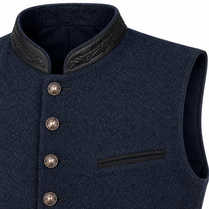 Close-up of a dark navy wool vest with a high collar, black leather-like trim, decorative buttons, and a welt pocket on a white background.