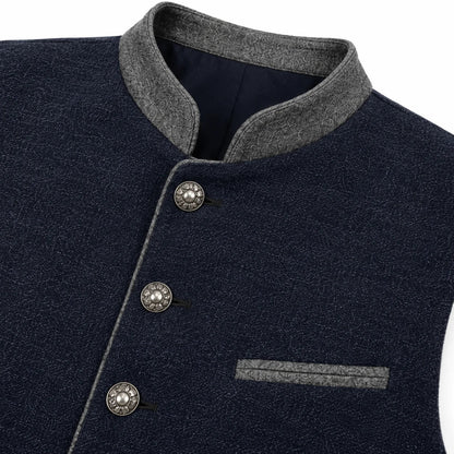 Close-up of a dark navy textured jacket with a gray mandarin collar, gray piping, and decorative silver buttons.