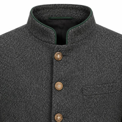 Close-up of a dark gray textured wool jacket with a mandarin collar, brown buttons, and a green piping accent on the collar.