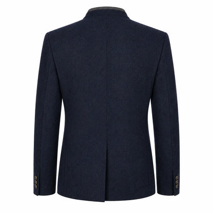 A dark navy blue wool-blend blazer shown from the back, featuring a structured collar, long sleeves, and a central seam, set against a plain white background.